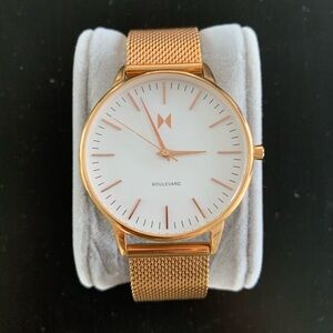 MVMT rose gold watch with mesh bracelet and white face